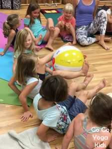 Get ready for yoga beach ball! This yoga game can be played with any size group of any ages. All you need is a beach ball to get started!